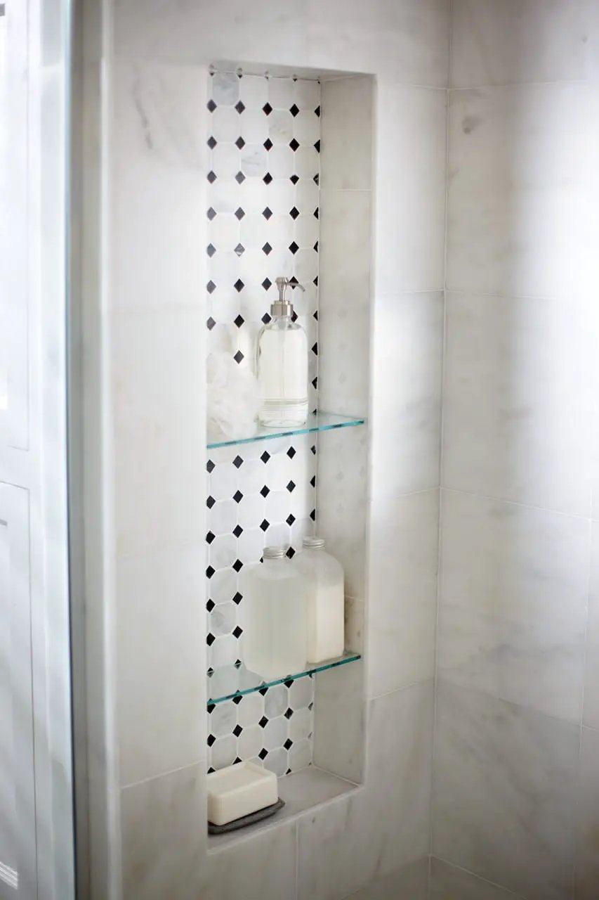 Greecian White 2" Octagon With Black 5/8x5/8 Polished In 12x12 Mesh Marble Mosaics in a finished room