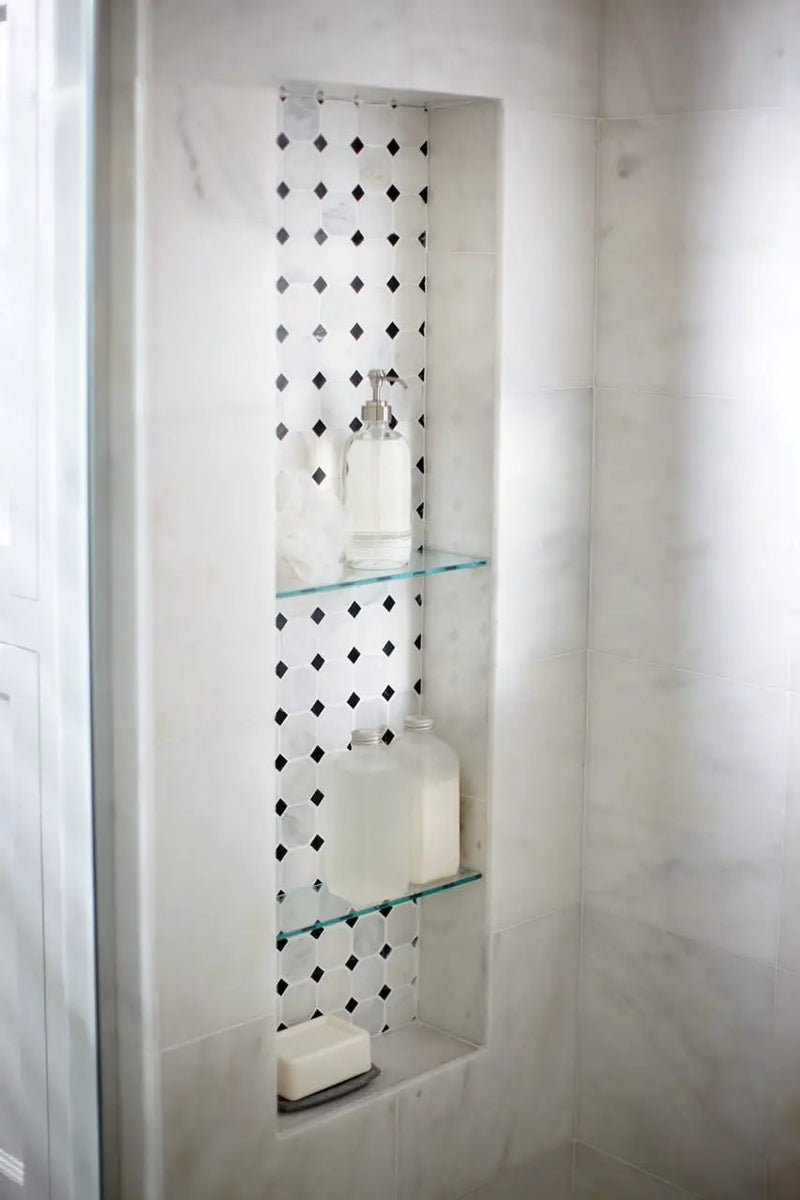 Greecian White 2" Octagon With Black 5/8x5/8 Polished In 12x12 Mesh Marble Mosaics in a finished room