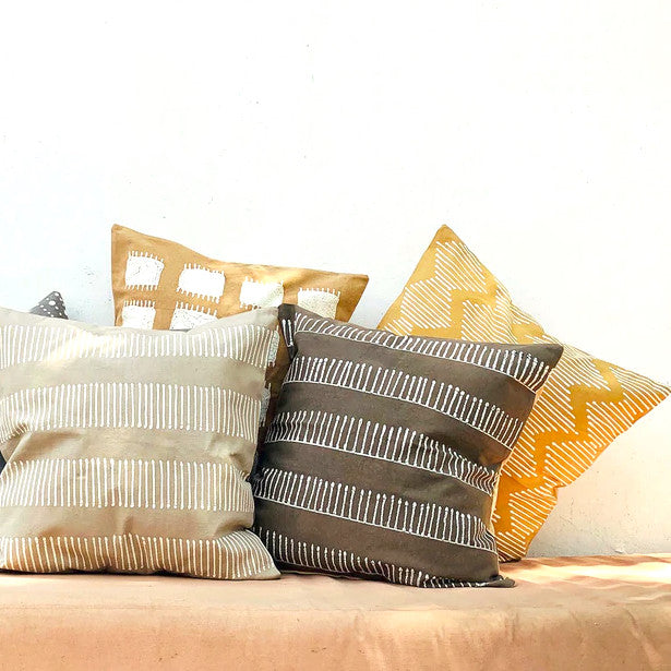 Tribal Cloth Rake Clay Pillow Cover, installed in a room