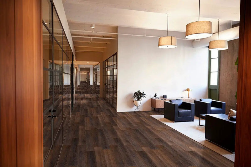 Smithcliffs Hillsdale Semi Gloss T Molding Wood Look Rigid Core Moldings 1.77x0.28 in a finished room