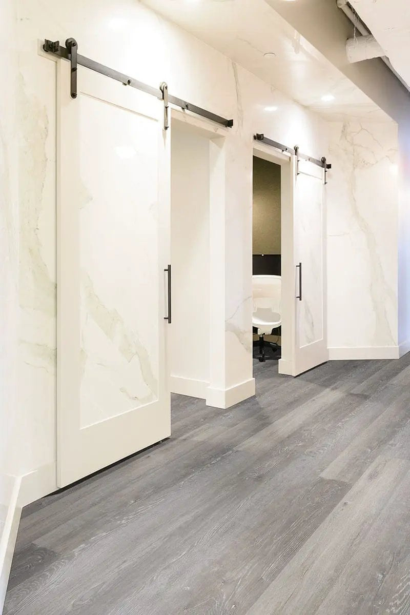 Glenridge Elmwood Ash Semi Gloss End Cap Wood Look Lvt Moldings 1.5x0.25 in a finished room