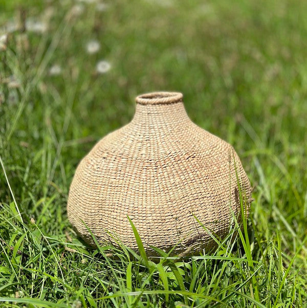 Garlic Tonga Sculptural Basket - Large, installed in a room