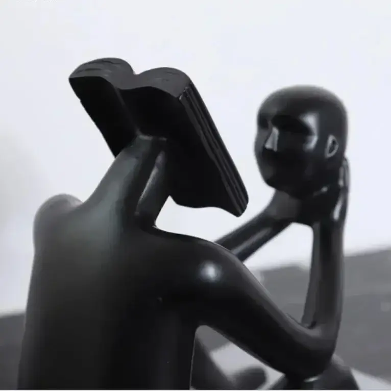Abstract Seated Figure Sculpture Holding a Head by House Of Avana