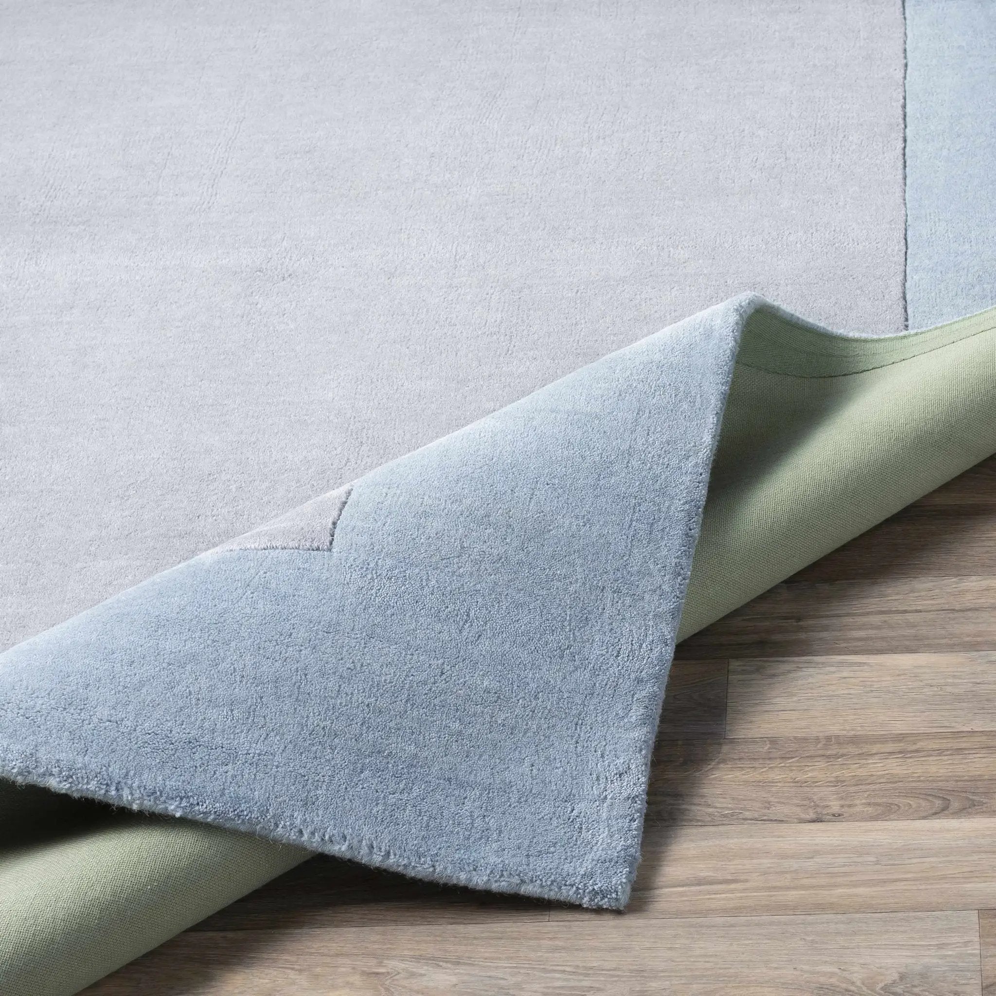 Arkabutla Solid Blue Bordered Wool Rug by Boutique Rugs