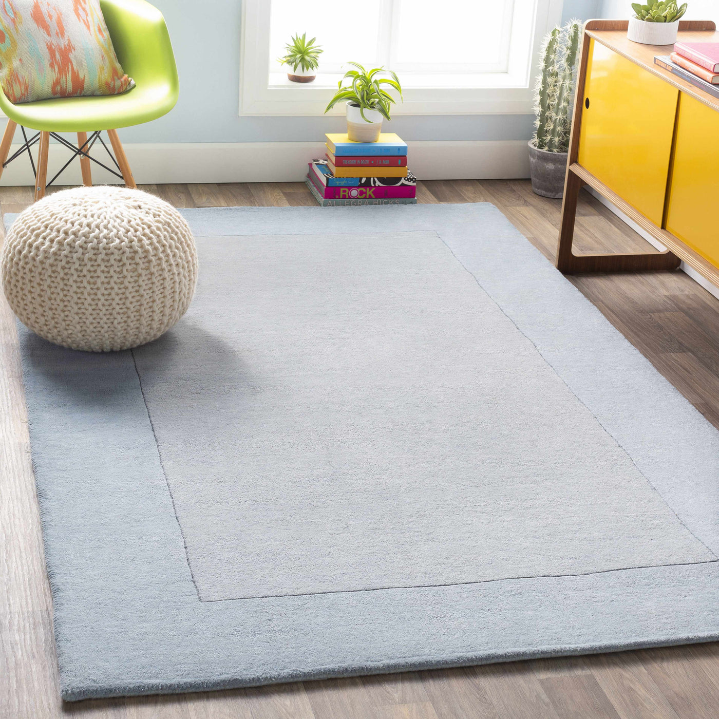 Arkabutla Solid Blue Bordered Wool Rug by Boutique Rugs