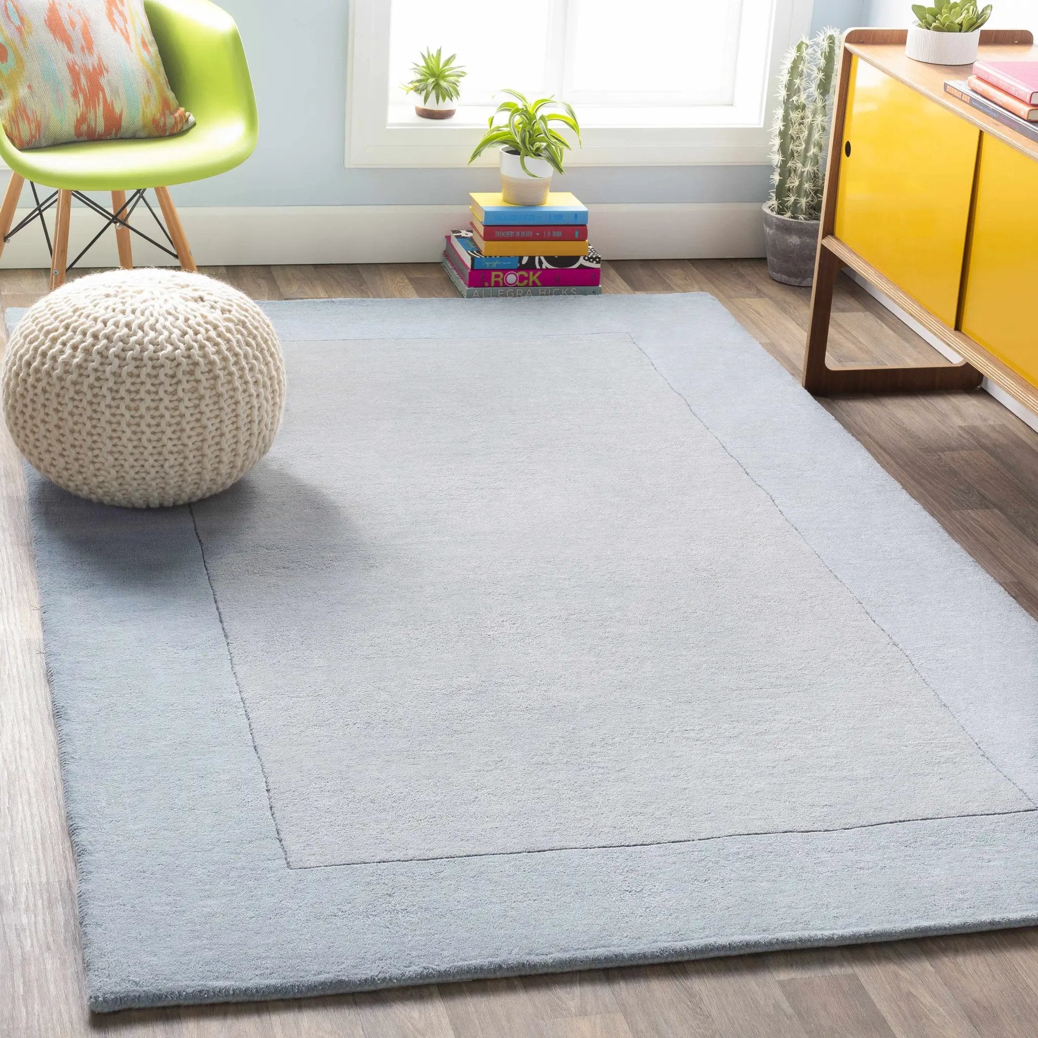 Arkabutla Solid Blue Bordered Wool Rug by Boutique Rugs