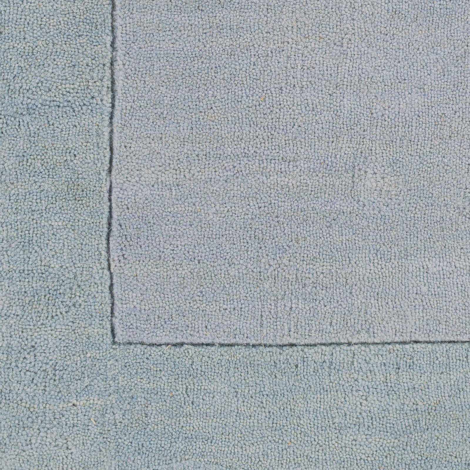Arkabutla Solid Blue Bordered Wool Rug by Boutique Rugs
