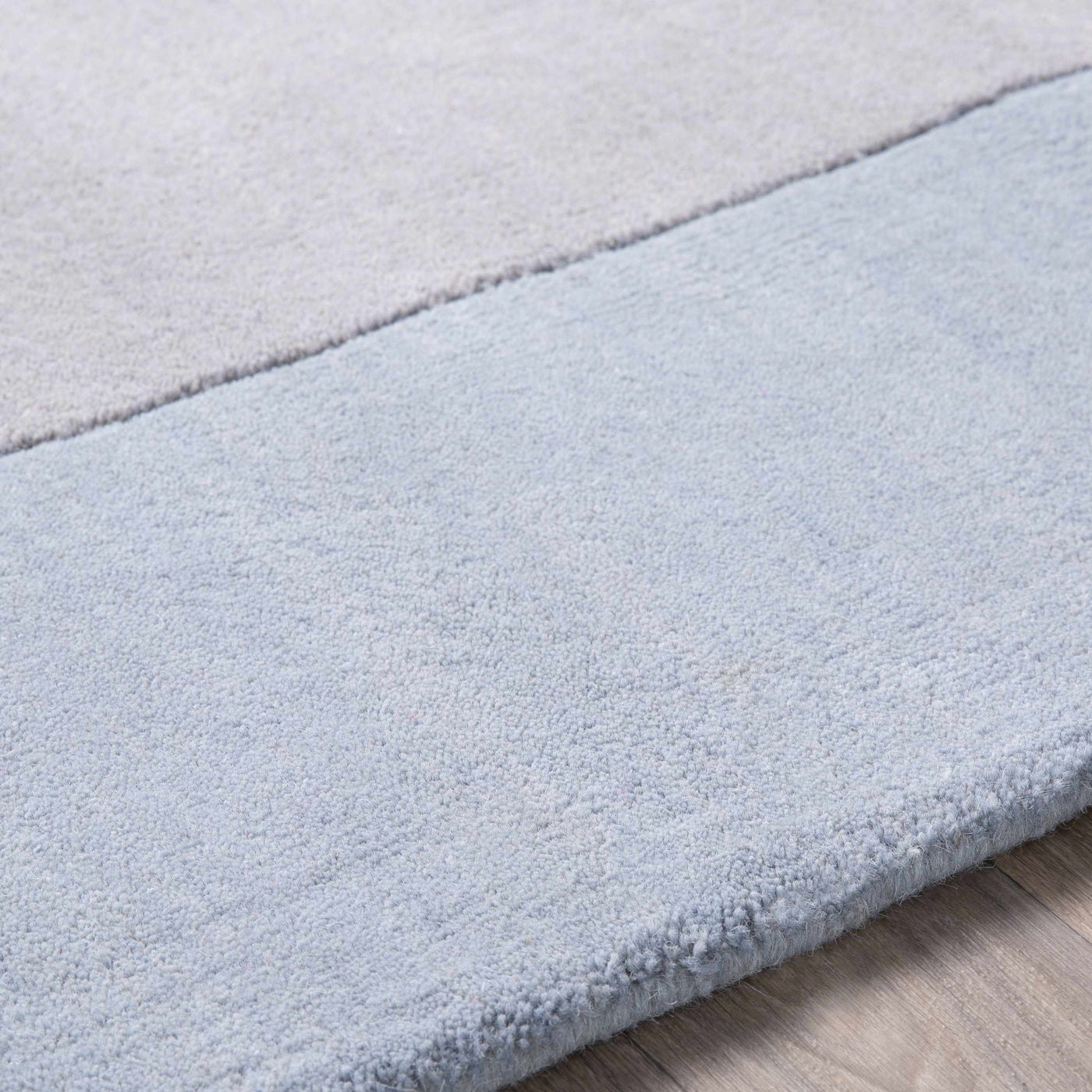 Arkabutla Solid Blue Bordered Wool Rug by Boutique Rugs