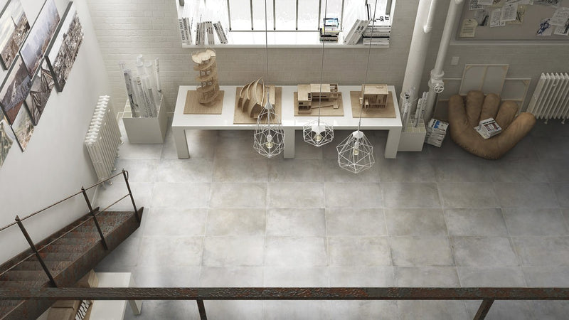 Brooklyn Cemento Argent Honed Concrete Look Cove Base Porcelain Trim 6x12 installed in a room