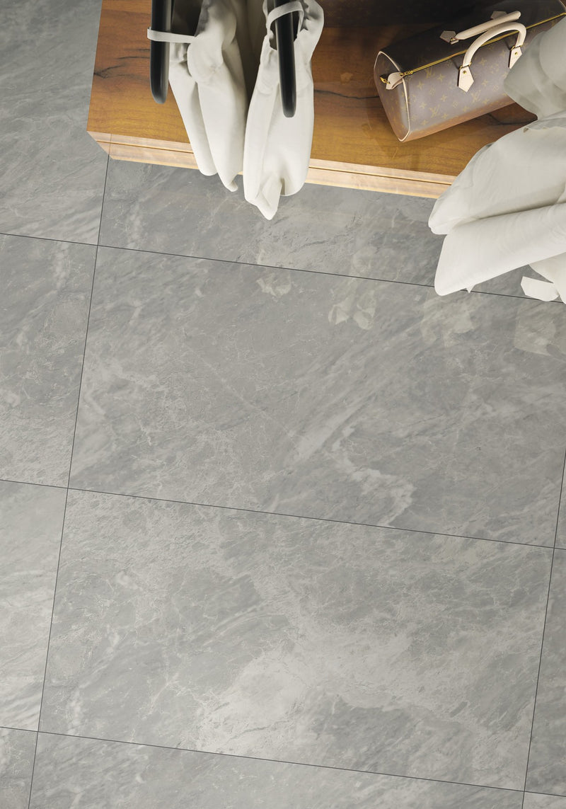 Carrara Select Blu Honed Marble Look Bullnose Porcelain Trim 4x24 installed in a shop