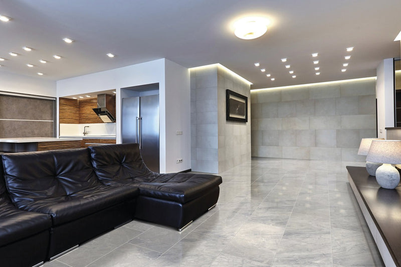 Carrara Select Blu Polished Marble Look Porcelain Tiles 12x24 installed in a living room