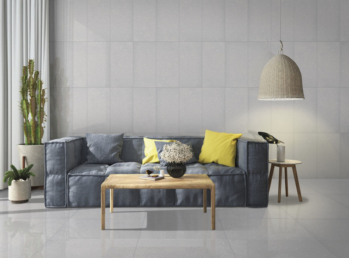 Deluxe 2.0 Delorian Grey Honed Stone Look Bullnose Porcelain Trim 4x24 installed in a living room