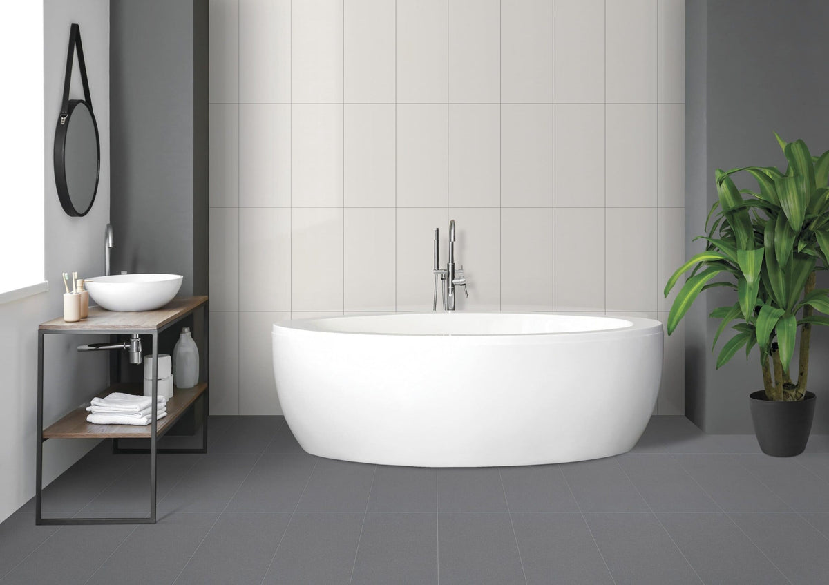 Deluxe 2.0 Ocean Storm Honed Stone Look Porcelain Tiles 24x24 installed in a bathroom