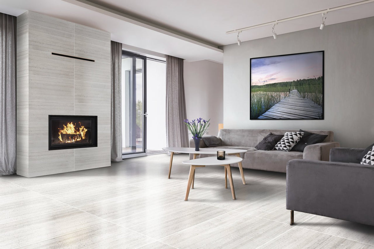 Ecocrete Melted Ice Honed Concrete Look Cove Base Porcelain Trim 6x12 installed in a living room