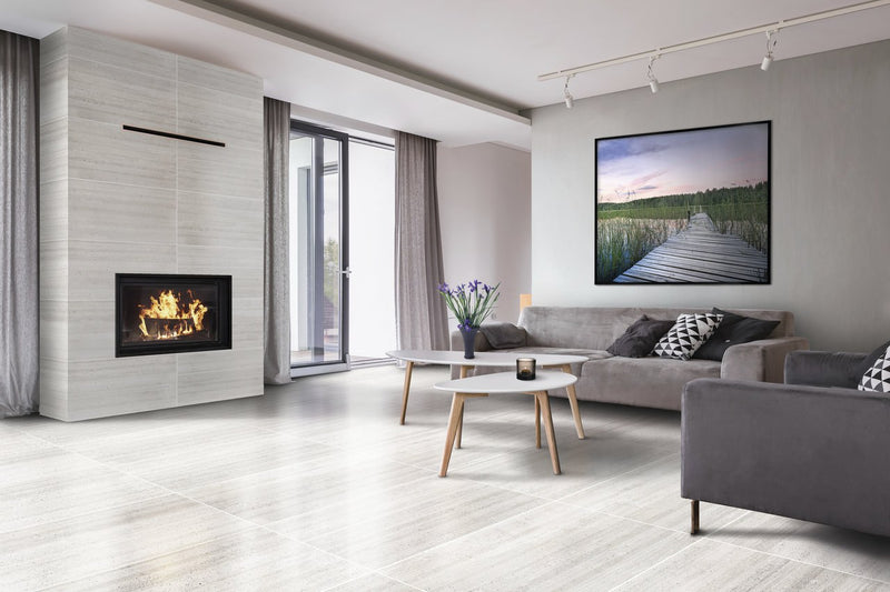 Ecocrete Melted Ice Honed Concrete Look Cove Base Porcelain Trim 6x12 installed in a living room