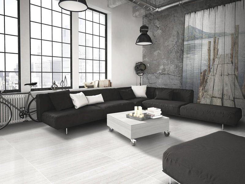 Ecocrete Melted Ice Honed Concrete Look Cove Base Porcelain Trim 6x12 installed in a living room, view 2