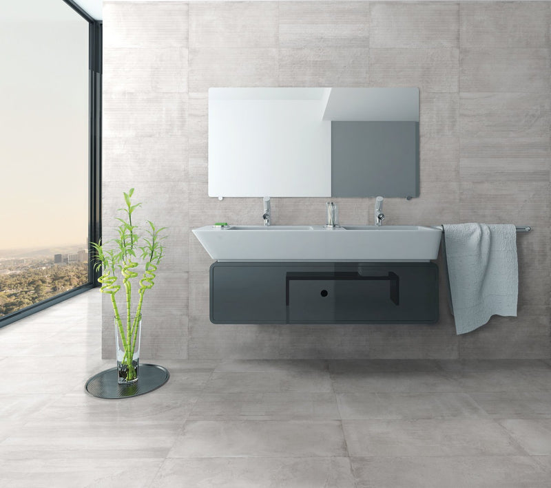 Ecocrete Melted Ice Honed Concrete Look Cove Base Porcelain Trim 6x12 installed in a bathroom