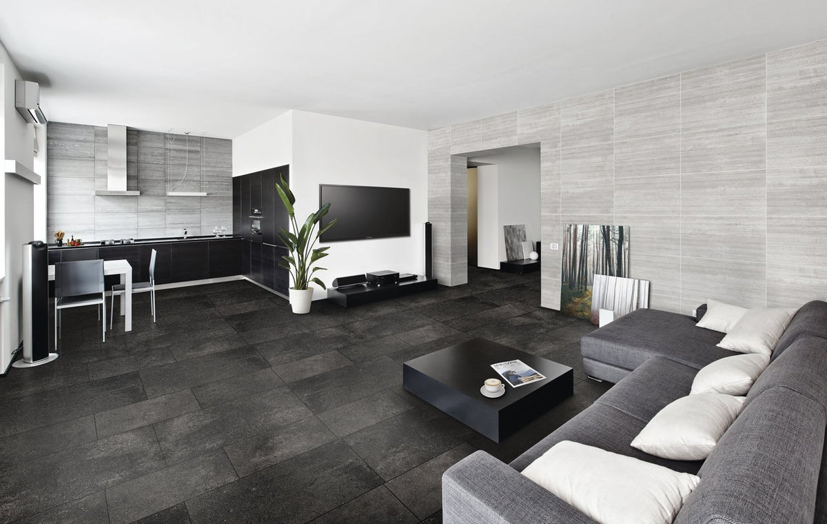 Ecocrete Weathered Black Honed Concrete Look Cove Base Porcelain Trim 6x12 installed in a living room, view 2