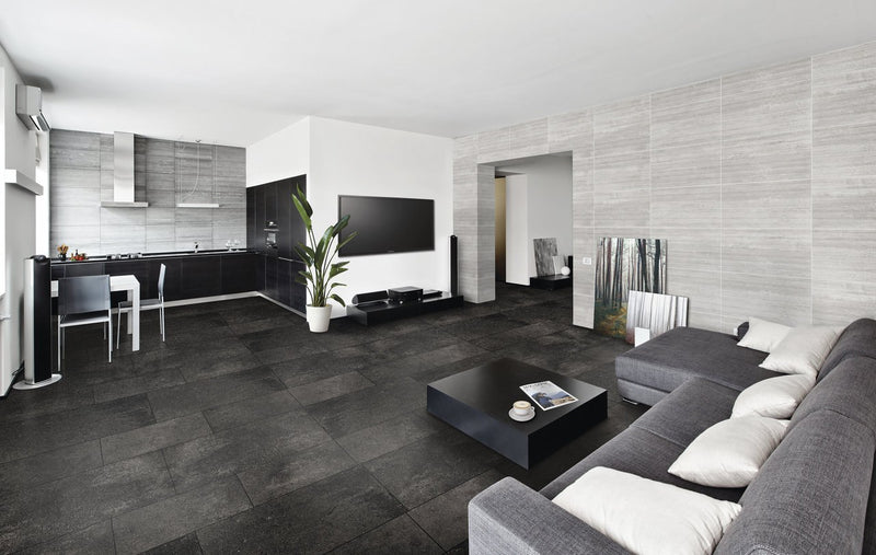Ecocrete Weathered Black Honed Concrete Look Cove Base Porcelain Trim 6x12 installed in a living room, view 2