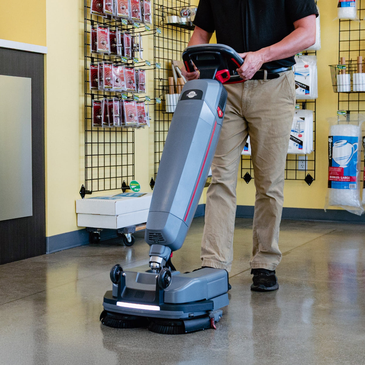 Tomahawk Electric Floor Scrubber Cleaner with 16” Power Mop Brushes Cordless Battery Powered, installed in a room