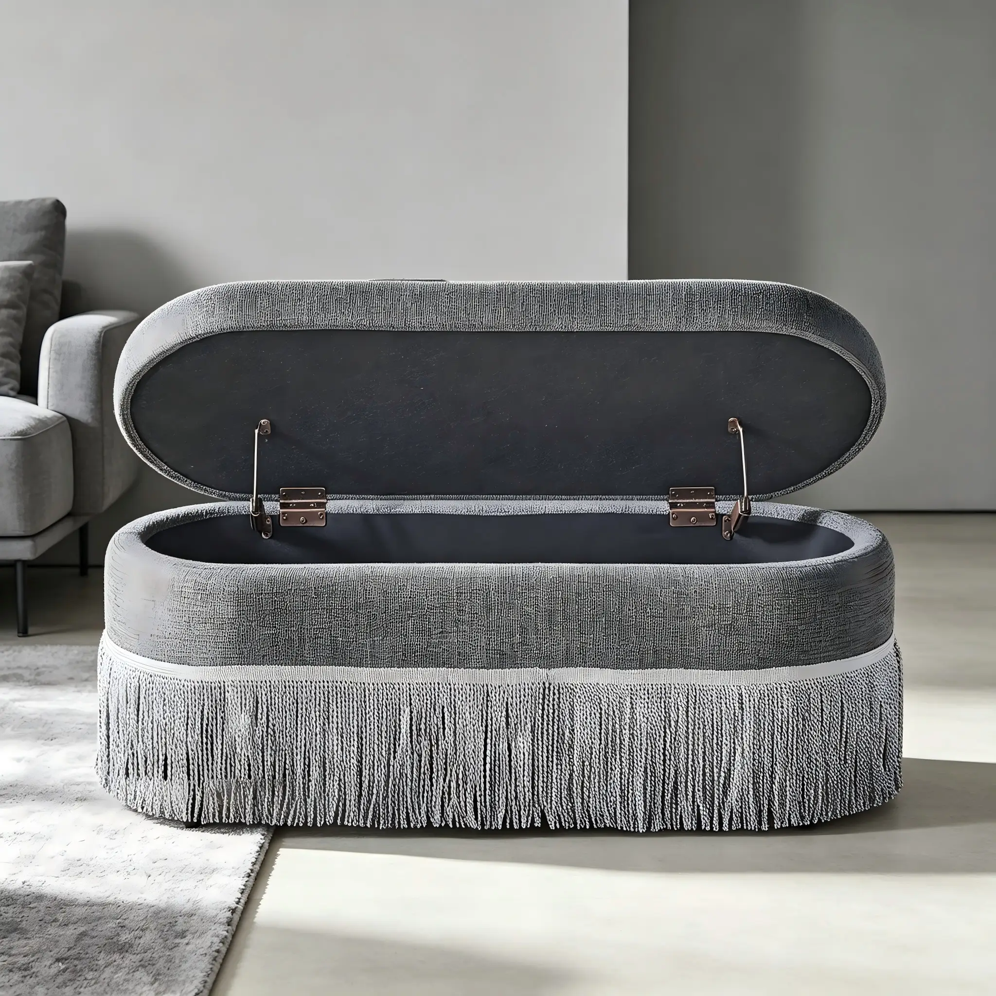 Oval Upholstered Storage Ottoman with Fringe Trim by HouseOfZazla