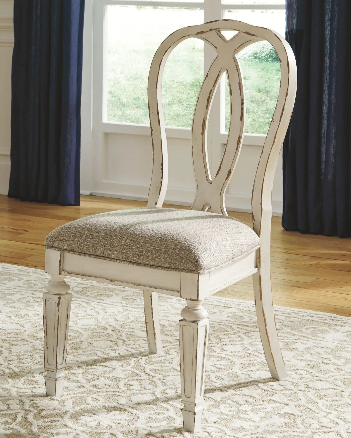 Realyn - Oval Dining Table Set by Unique Piece Furniture