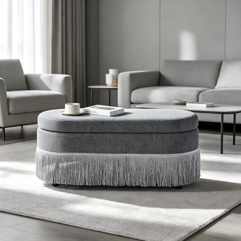 Oval Upholstered Storage Ottoman with Fringe Trim by HouseOfZazla