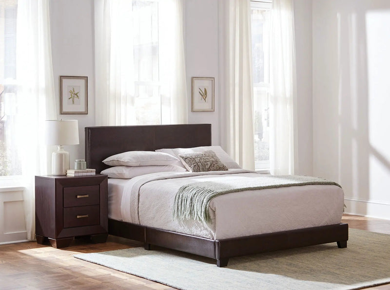 Dorian Faux Leather Upholstered Eastern King Panel Bed Brown by Unique Piece Furniture