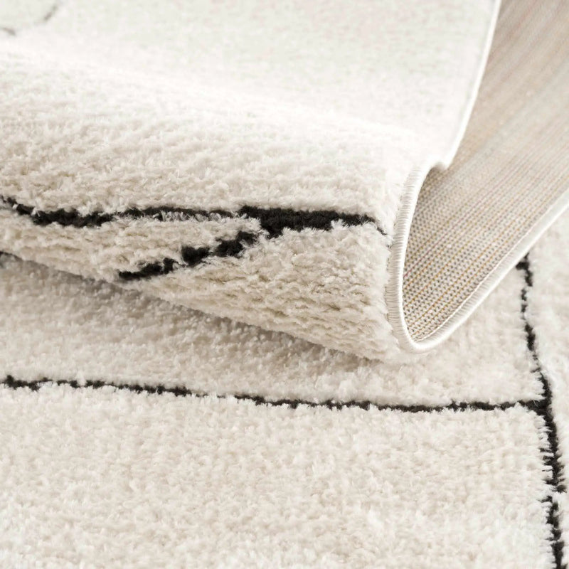 Keats Black & White Area Rug by Boutique Rugs
