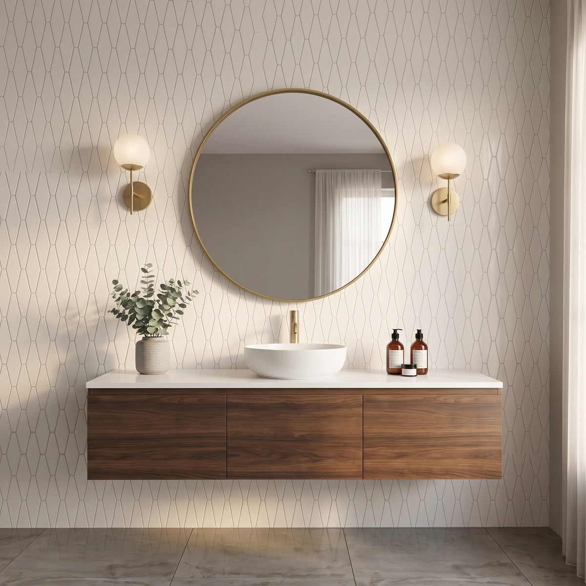 A modern floating bathroom vanity with a white vessel sink, gold faucet, round gold-framed mirror, and two wall sconces against patterned wallpaper.