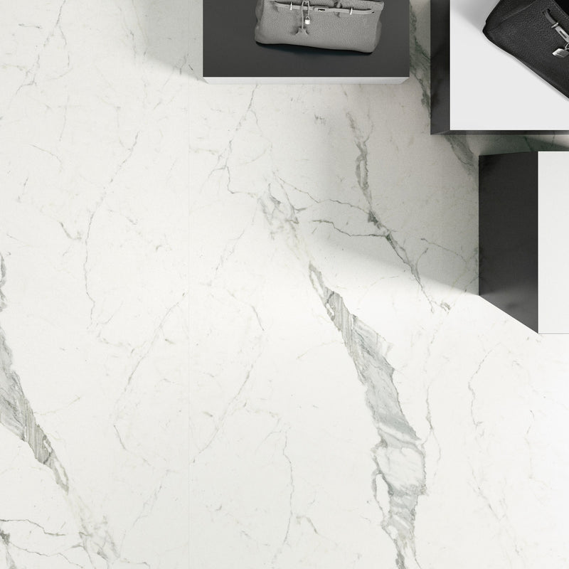 Plane 2.0 Statuarietto Natural Marble Look Porcelain Slab 60x120 6mm installed in a shop, view 2