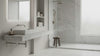 Italian Carrara Honed Marble Tiles 18x18 installed on a modern bathroom floor and wall-hung marble sink and counter. Wooden stool in a shower