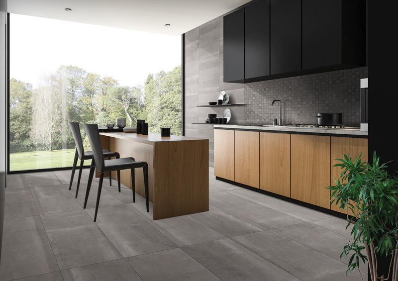 Reside Ash Honed 2x2 Stone Look Porcelain Mosaics 12x12 installed in a kitchen