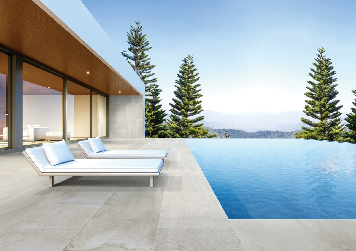 Reside Beige Honed Stone Look Porcelain Tiles 24x48 installed in a pool area