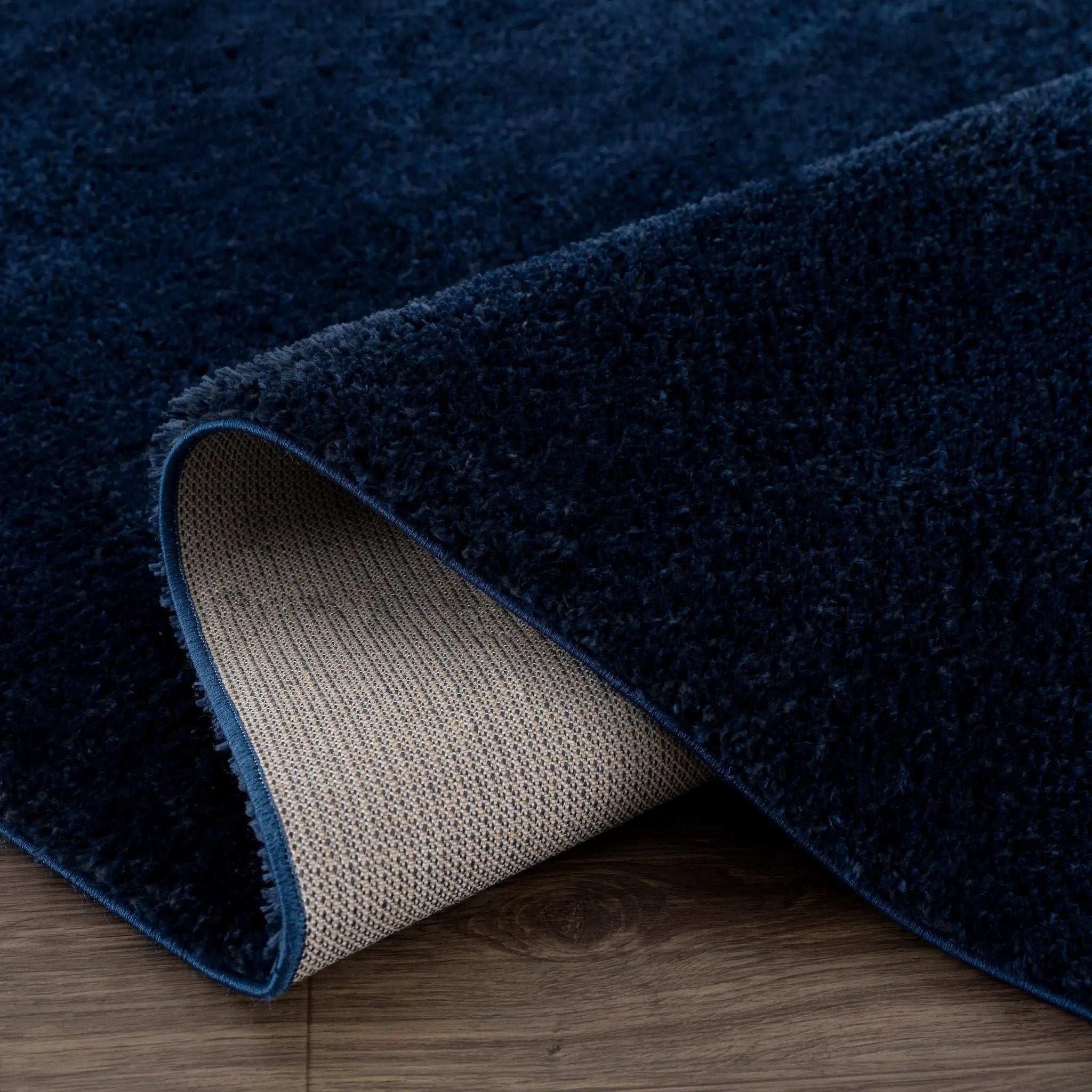 Navero Dark Blue Subtle Wavy Abstract Modern Minimalist Polyester Machine Woven Area Rug - Clearance by Boutique Rugs