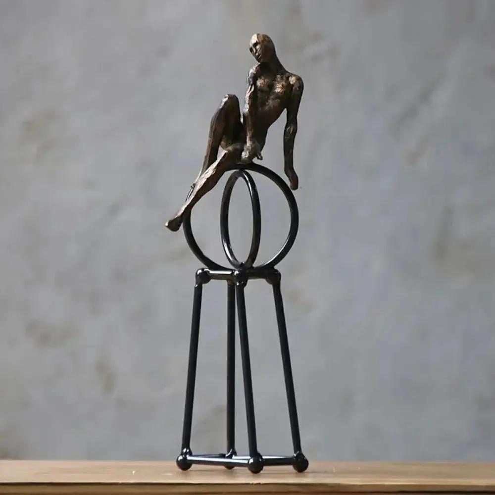 Abstract Seated Figure Sculpture on Geometric Stand – Modern Iron Table Decor by House Of Avana