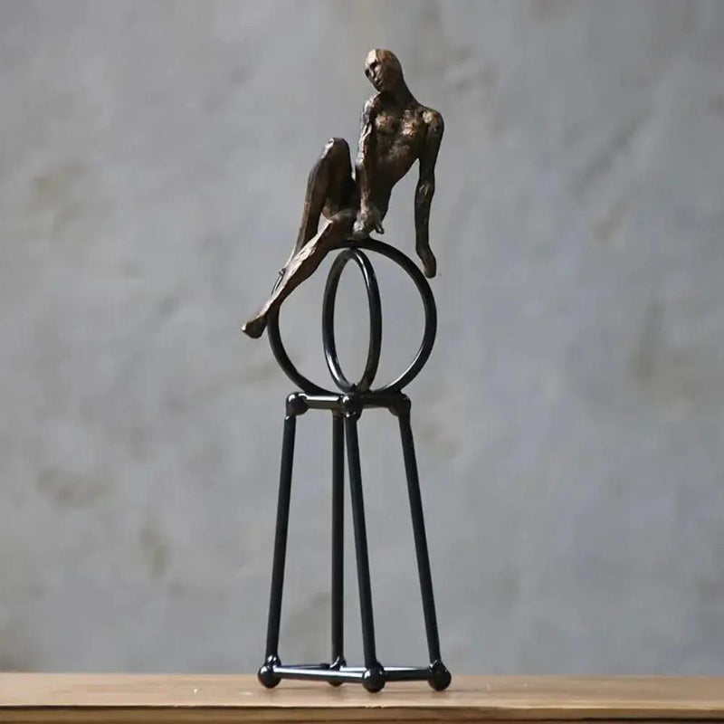 Abstract Seated Figure Sculpture on Geometric Stand – Modern Iron Table Decor by House Of Avana