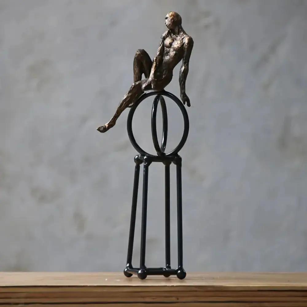 Abstract Seated Figure Sculpture on Geometric Stand – Modern Iron Table Decor by House Of Avana