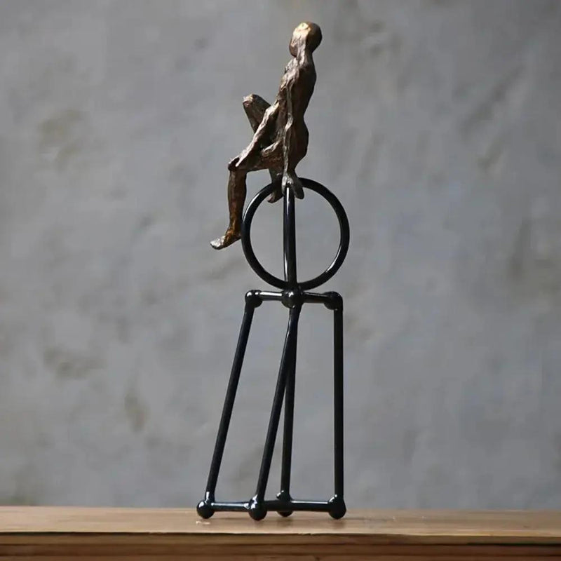Abstract Seated Figure Sculpture on Geometric Stand – Modern Iron Table Decor by House Of Avana