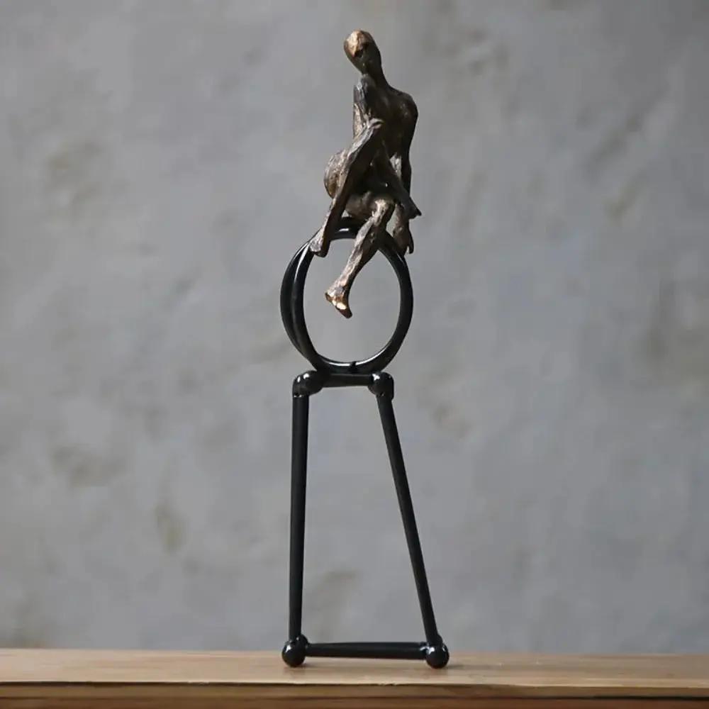 Abstract Seated Figure Sculpture on Geometric Stand – Modern Iron Table Decor by House Of Avana