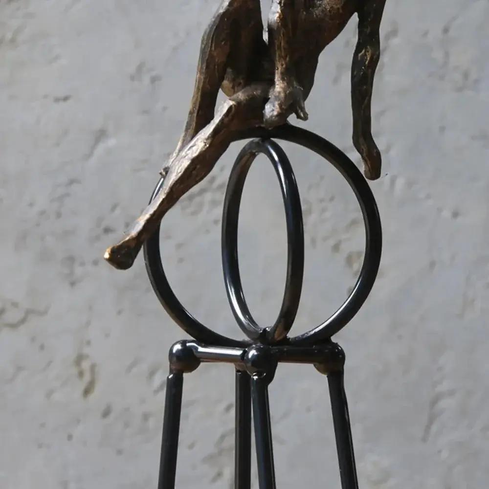 Abstract Seated Figure Sculpture on Geometric Stand – Modern Iron Table Decor by House Of Avana