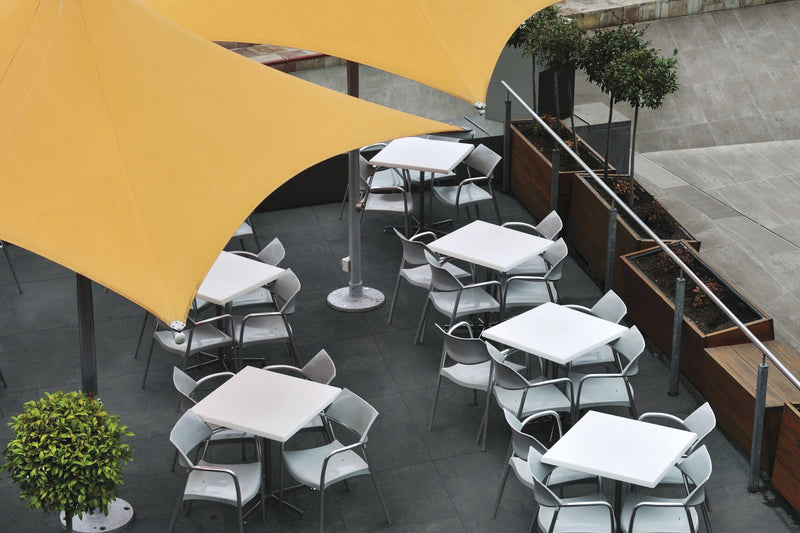 Simply Modern Black Honed Concrete Look Porcelain Tiles 12x24 installed in a cafe