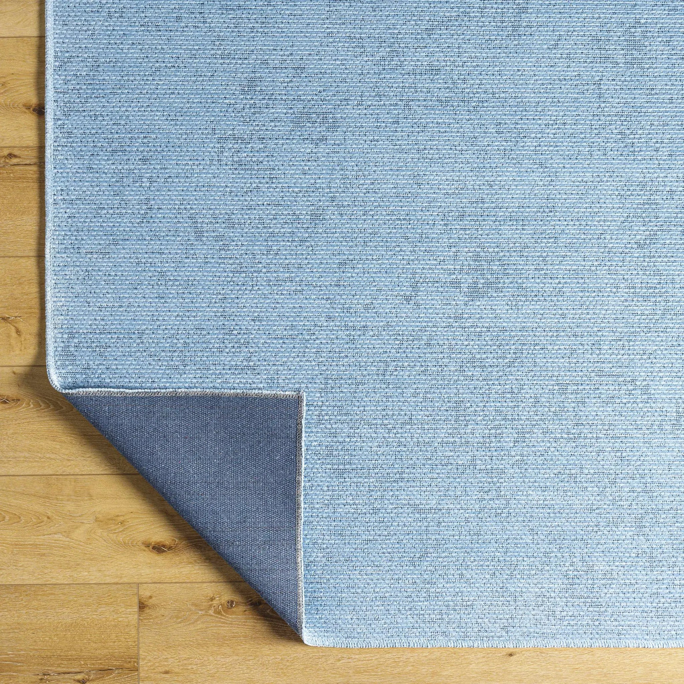 Isako Blue Solid Washable Area Rug - Clearance by Boutique Rugs