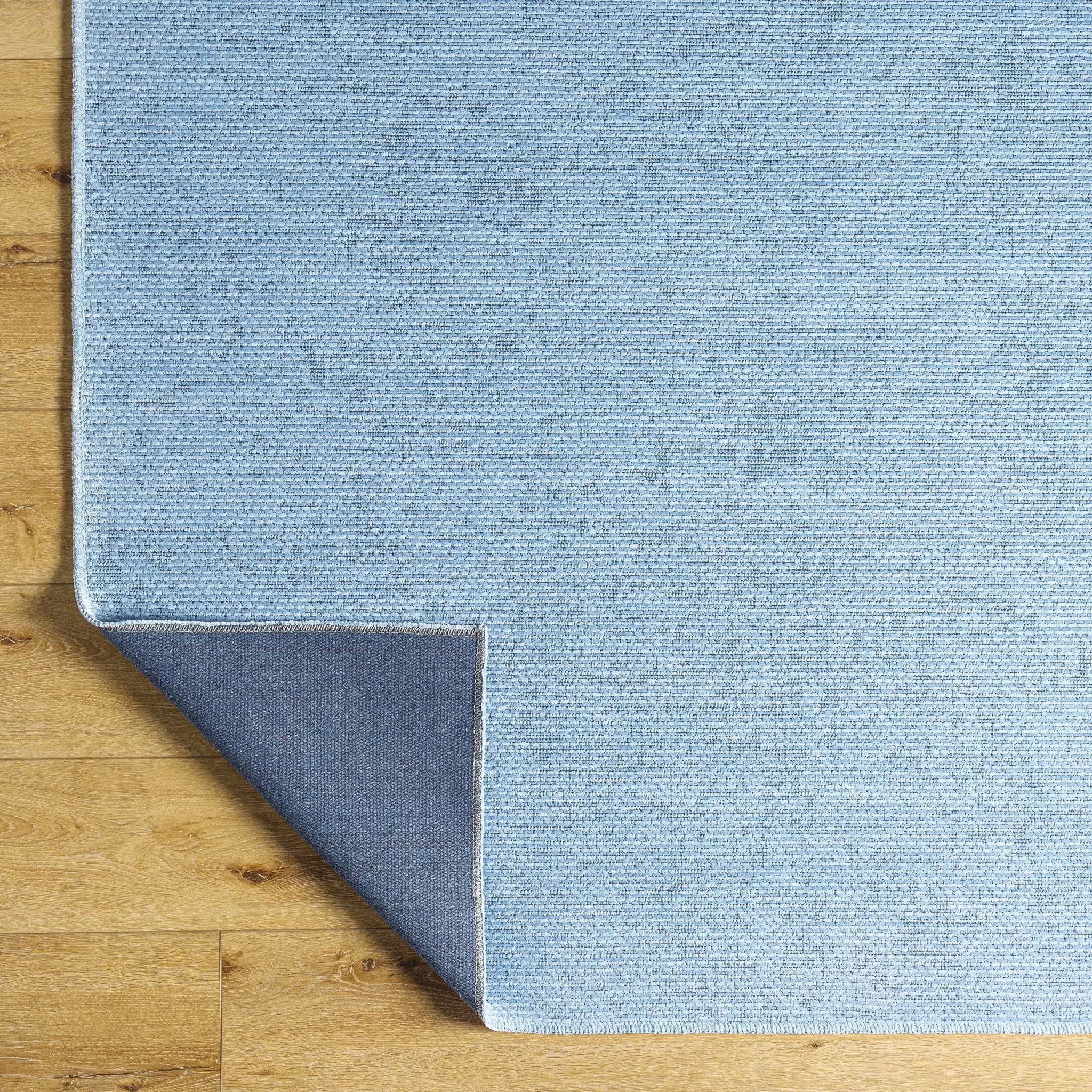 Isako Blue Solid Washable Area Rug - Clearance by Boutique Rugs