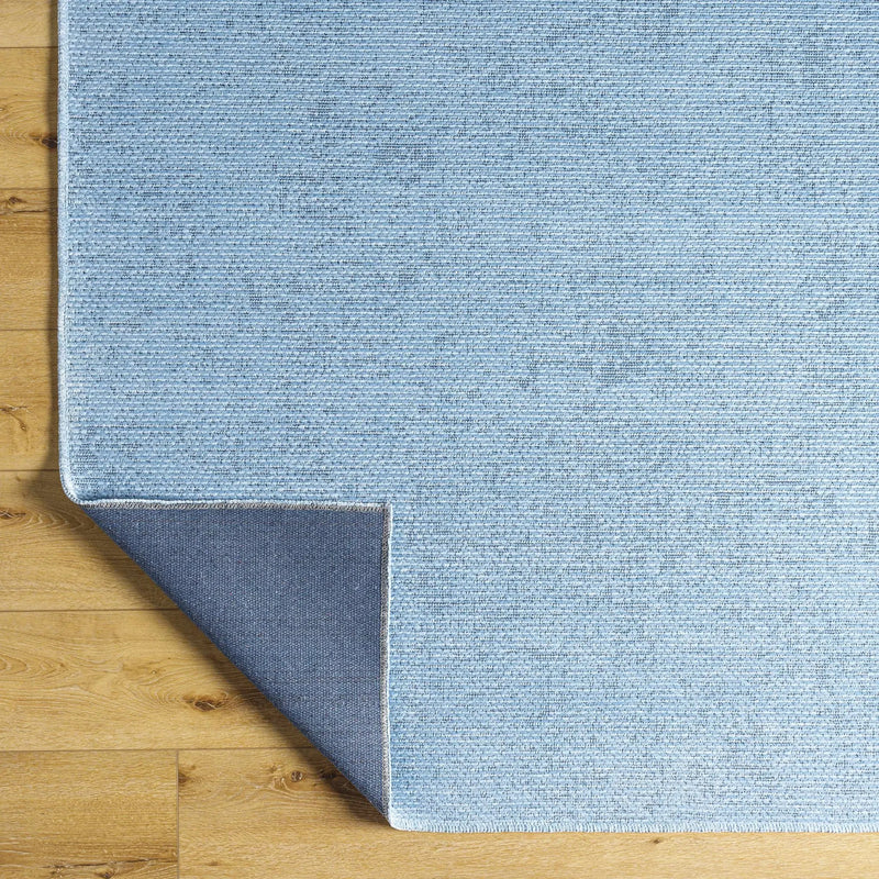 Isako Blue Solid Washable Area Rug - Clearance by Boutique Rugs