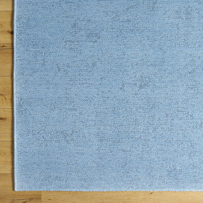 Isako Blue Solid Washable Area Rug - Clearance by Boutique Rugs