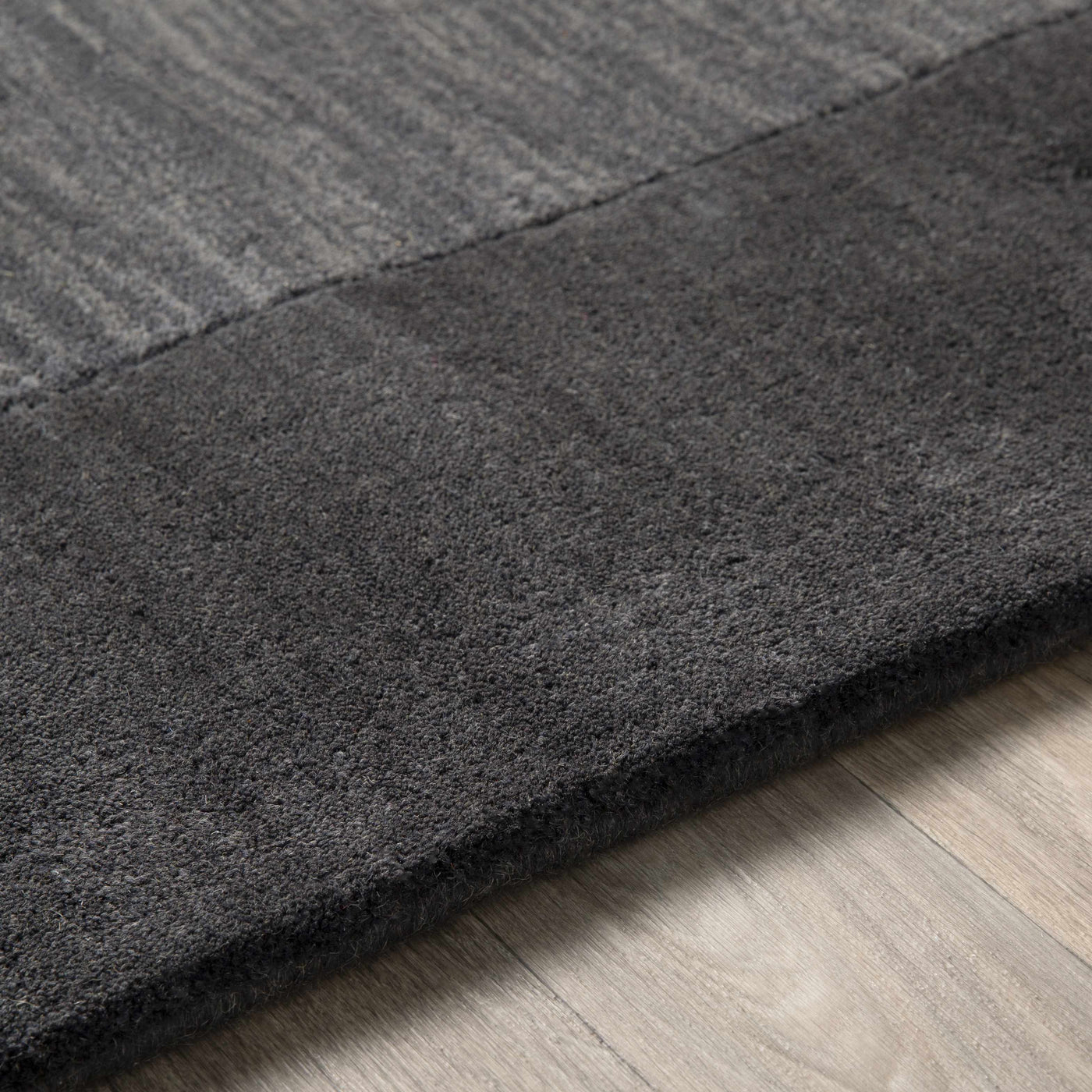 Bordered Solid Black Charcoal Wool Rug by Boutique Rugs
