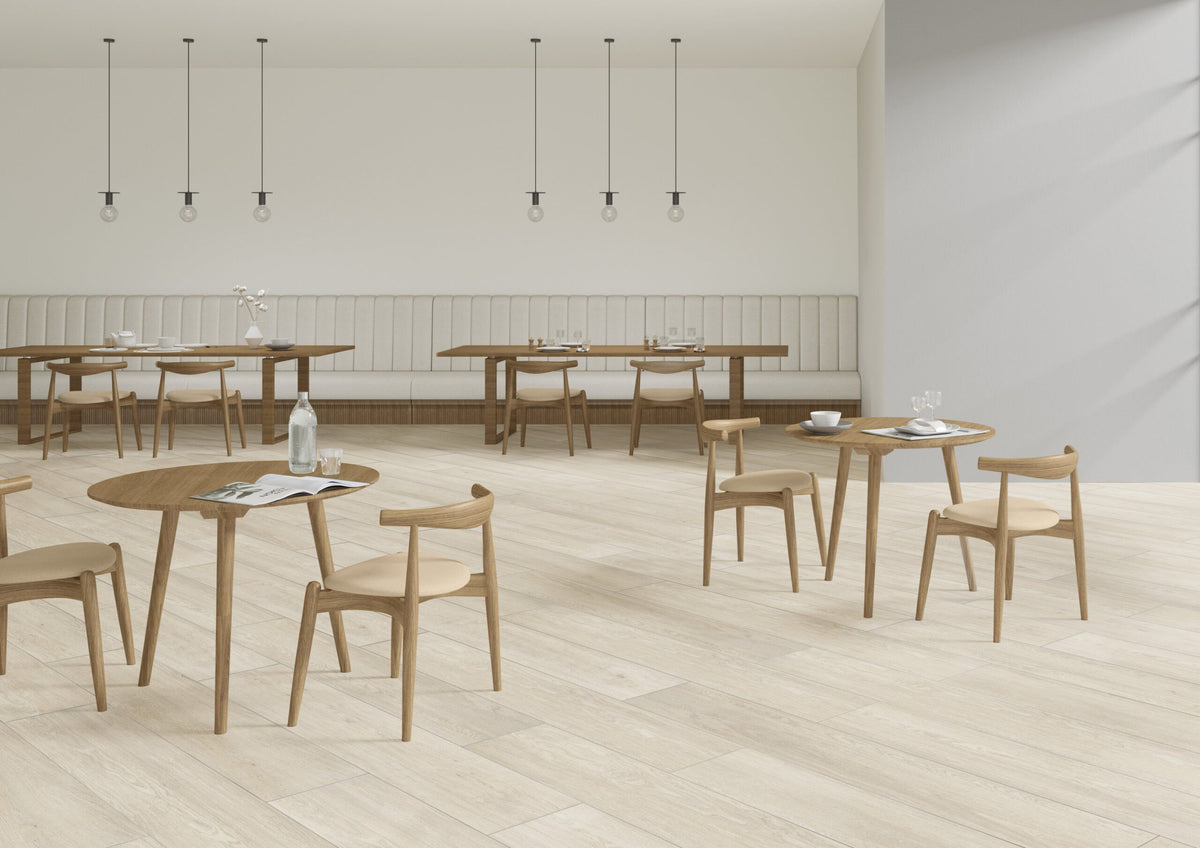 Venatura Frost Natural Plank Wood Look Porcelain Tiles 12x72 installed in a cafe