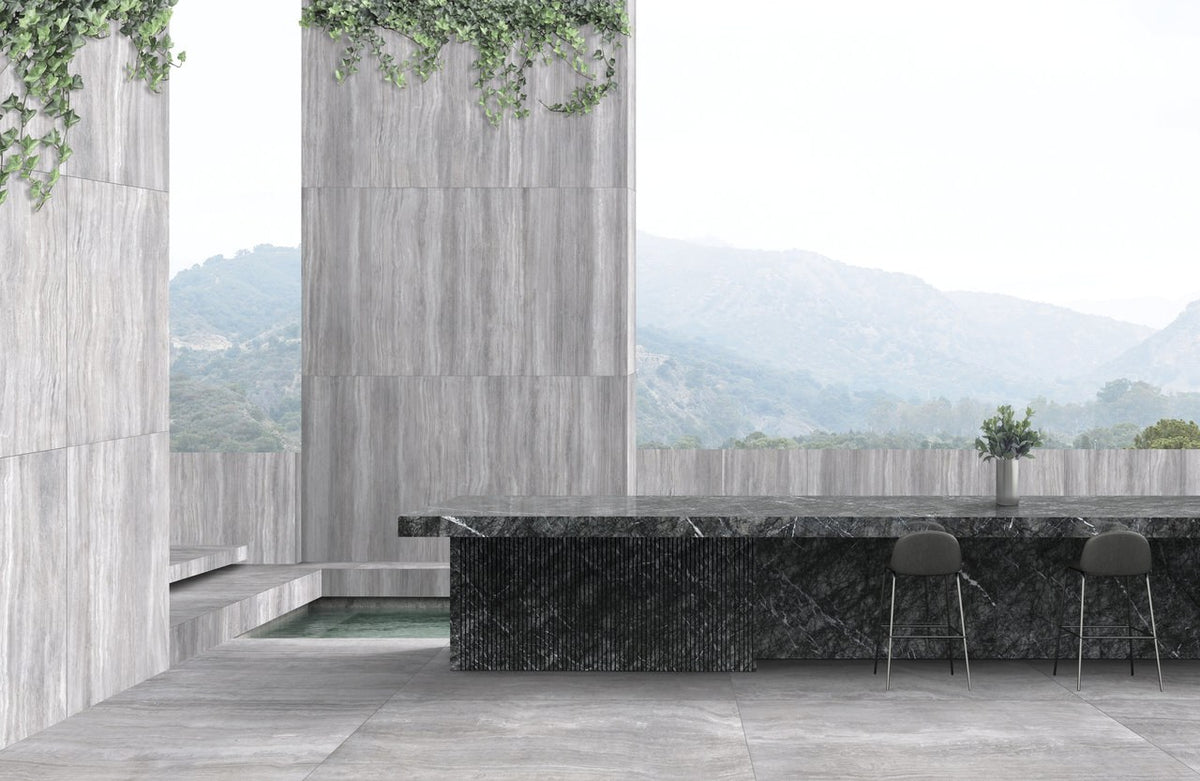 Zenit Grey Honed Travertine Look Cove Base Porcelain Trim 6x12 installed in an outdoor space