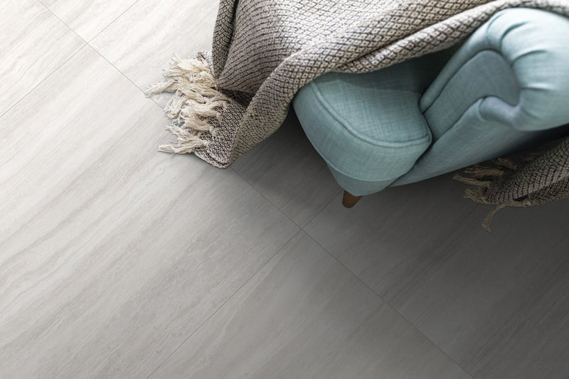 Zenit White Polished Travertine Look Bullnose Porcelain Trim 4x24 installed in a room, view 2